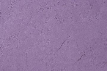 Purple colored decorative plaster surface. Pastel shades purple concrete background.