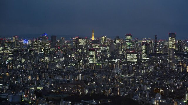 TOKYO, JAPAN : Aerial high angle CITYSCAPE of TOKYO at night. View of buildings around Shinjuku and Minato ward. Japanese city life, business and urban metropolis concept shot. Real time fixed shot.
