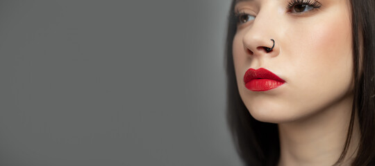 Young Brunette Woman face portrait. Beauty model girl with perfect skin and red lips, web banner.