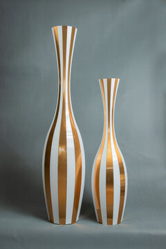 Decorative vases on a gray background.