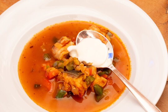 Halaszle, Hungarian Fishermans Soup or Fish Stew with Carp, Bell Peppers, Paprika and Sour Cream