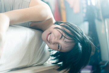 Portrait young adult asian woman relax in bedroom on morning.