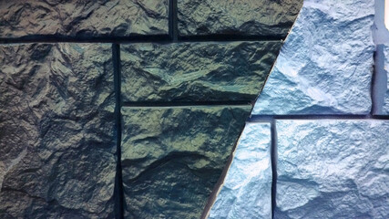 Background of facade panel. Samples combination of basement siding with stone imitation dark gray...