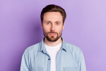 Photo of young calm handsome good looking businessman wear denim shirt isolated on purple color background