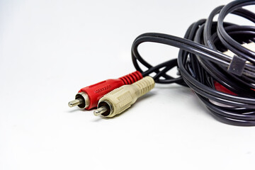 Two red and white audio RCA plugs isolated on a white background. Analog technology