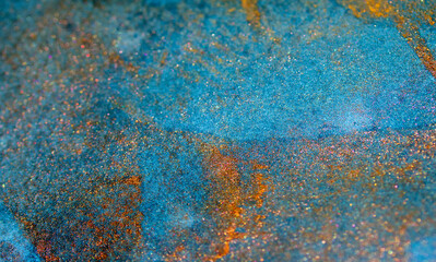 Blue and Bronze Paint on a Textured Background