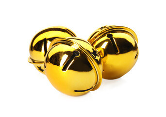 Shiny golden sleigh bells on white background
