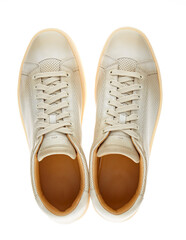 Pair of sand-colored perforated leather athletic shoes, with laces and a polyurethane sole,...