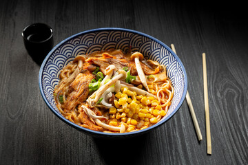 Japanese miso ramen soup on dark background viewed from above. Japanese noodles.