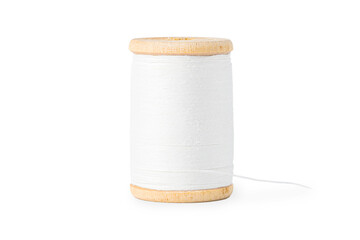 wooden spool with white thread close up on white background