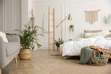 Modern bedroom with beautiful fresh house plants - Powered by Adobe