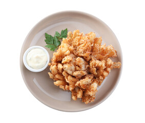 Plate with fried blooming onion and sauce isolated on white, top view