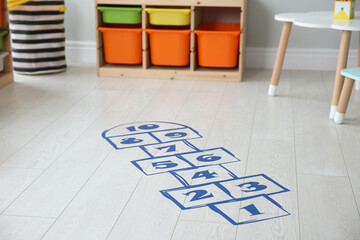 Blue hopscotch floor sticker in playing room
