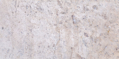 Dolomite natural stone texture. Stone with beige pattern on a smooth surface.