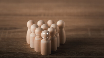 A wooden doll placed on the desk.