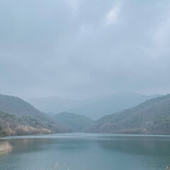 Mountains and lake. Beautiful landscape hand-painted with watercolor. Wall art. Image for poster, interior design. Blue and green colors. Travel and mountaineering.