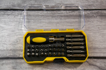 Set. Screwdriver with various attachments in the box.