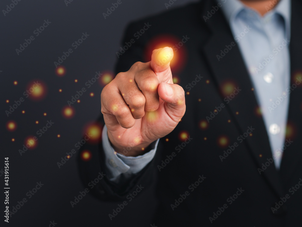 Poster businessman pressing a button on virtual screen. man pointing on a futuristic interface. space for t