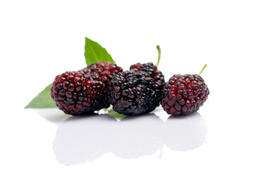 Ripe and delicious black mulberry on white background. 