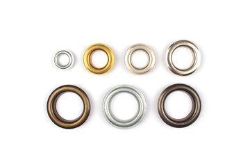 Catalogue photo of different brass multicoloured metal eyelets or rivets - curtains rings for...