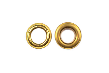 Catalogue photo of brass multicoloured metal eyelets or rivets - curtains rings for fastening fabric to the cornice, isolated on white background with copyspace for text. Selective focus