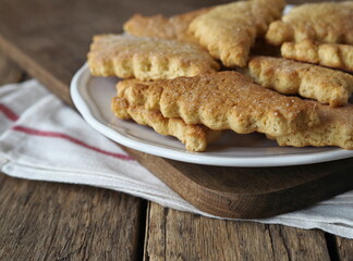 Homemade honey shortbread cookies with carved edges on a wooden background.Healthy natural food.