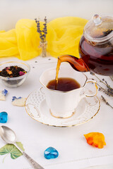 tea ceremony, kettle with black tea, poured into a cup