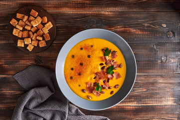 Traditional pumpkin puree cream soup with carrots, onions, ginger, garlic, coconut milk. Added...