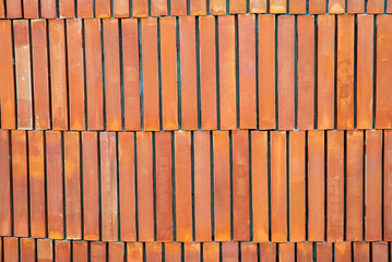 Brick wall with red brick, orange brick vintage background. concrete texture with vignette. new color wall suitable for pattern background design. dirty wallpaper indoor interior on natural light