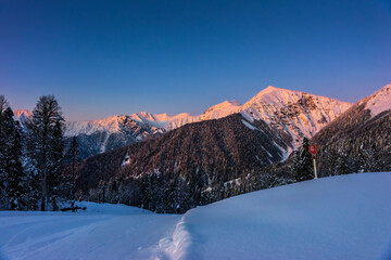 Caucasus mountains winter landscape at sunset. 