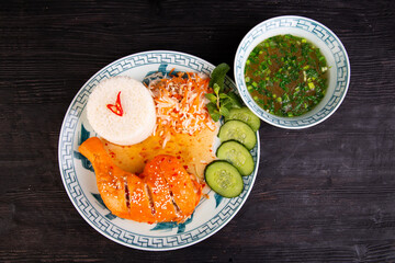 broth with chopped onions, served with chicken ham in sauce, sprinkled with sesame, fresh cucumbers, cabbage, rice