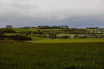 A dramatic sky during spring over the dutch rolling hills in the south of Limburg close to Maastricht.