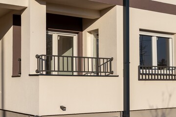 Fragment of a modern new low-rise building with a loggia on the - obrazy, fototapety, plakaty