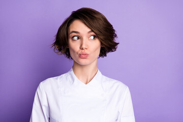 Photo of funky dream nice happy woman look empty space send air kiss cook isolated on purple color background