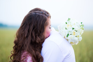 Naklejka premium Bride and groom in field. Muslim marriage.