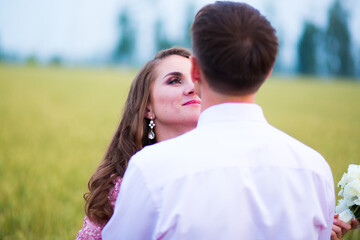 Bride and groom in field. Muslim marriage.