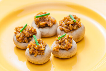 mushrooms stuffed with red paprika spiced rice and onion