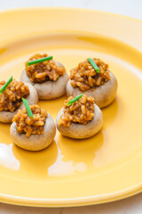 mushrooms stuffed with red paprika spiced rice and onion
