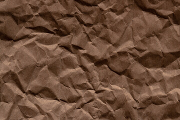 crumpled paper.sheet of brown cardboard paper. detailed high resolution texture. abstract background for wallpaper.