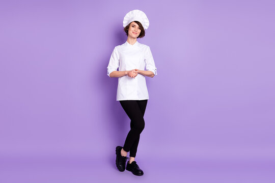 Full length body size view of attractive cheerful girl chef posing isolated over pastel violet purple color background