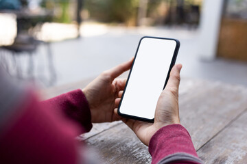 cell phone blank white screen mockup.woman hand holding texting using mobile on desk at office.background empty space for advertise.work people contact marketing business,technology