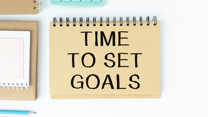 WHITE SPIRAL NOTEBOOK, TWO PENCILS WITH TEXT Time To Set Goals