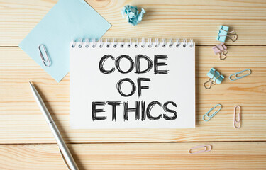 Text Code Of Ethics on notebook. Concept meaning basic guide for professional conduct