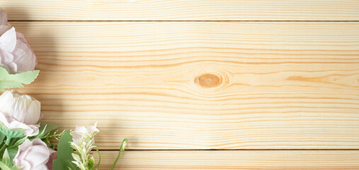 Background with bright pink flowers on wooden planks. Selective focus. Place for text.