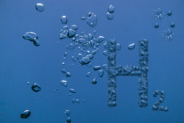 h2 hydrogen letter with many air bubbles in blue water