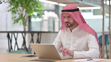 Professional Arab Businessman Working on Laptop 