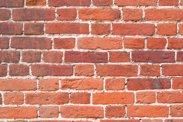 Red old brick wall. Full frame textured background. Copy space