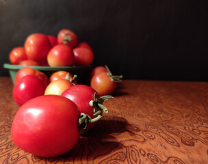Fresh Tomato in plate with Black background selective focus with copy space