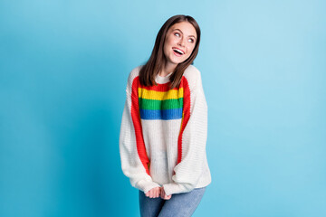 Portrait of adorable satisfied lady beaming smile look empty space wear pullover isolated on blue color background