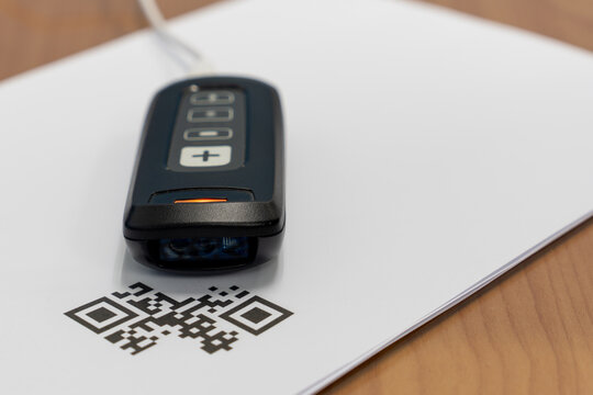 Documents waiting to read by barcode reader for convert data into the computer with mini barcode reader for 1D, 2D or QR Code.